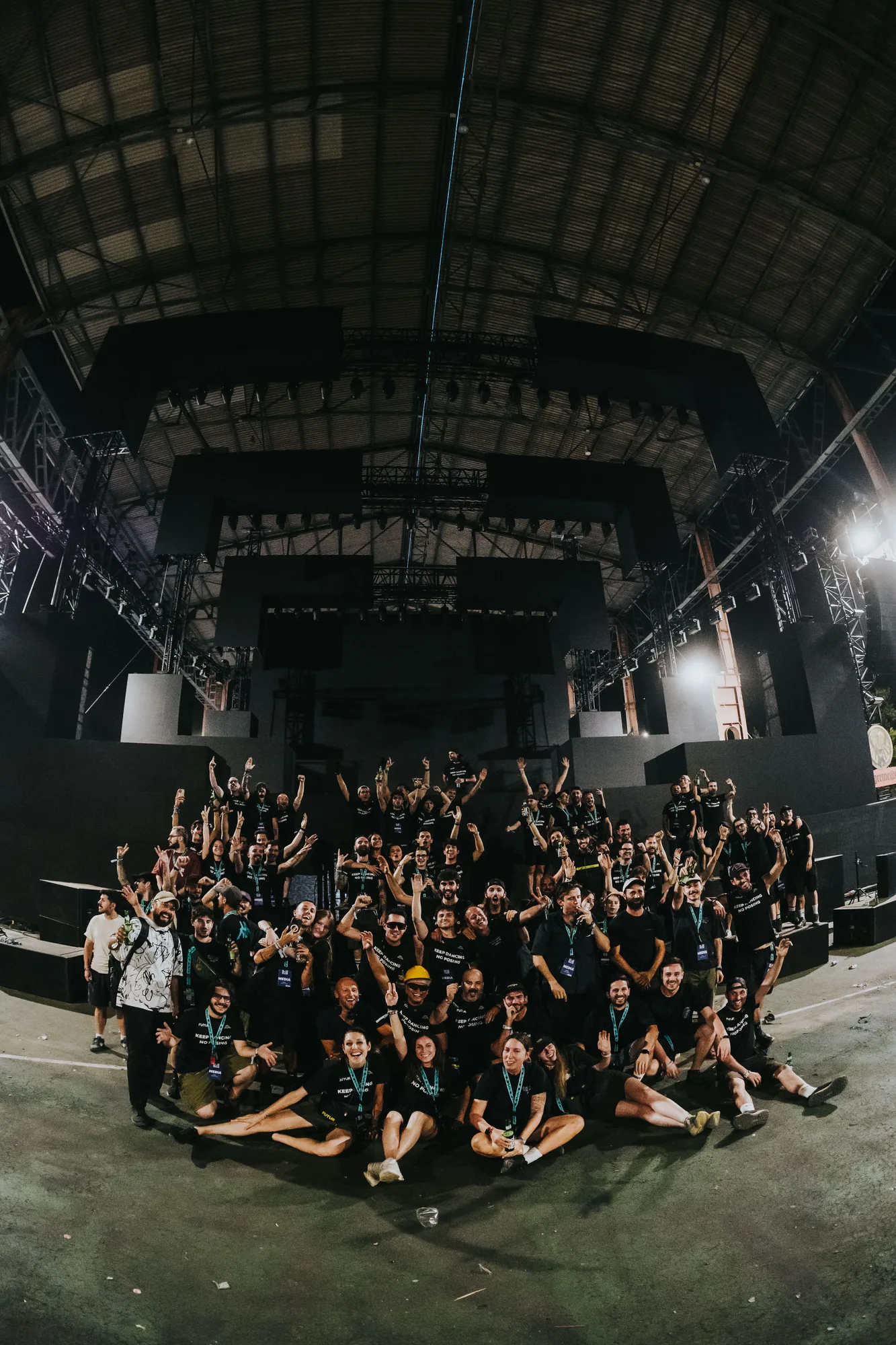 The Kappa FuturFestival 2026 media crew gathered on the main stage at the end of the event for a group photo, staff wearing MEDIA passes and Keep dancing no posing t-shirts.