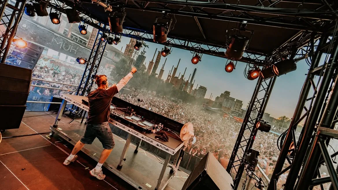 Kappa FuturFestival 2026 stage at Parco Dora, Turin, with the crowd and the old industrial structures in the background in daylight.